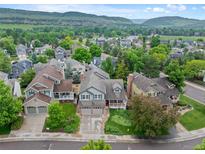 Charming neighborhood with mature trees, manicured lawns, and mountain views at 18 Blue Sage, Littleton, CO 80127
