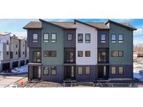 Modern townhome development showcasing three-story units with sleek, contemporary design at 5193 Carr St, Arvada, CO 80002