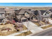 Beautiful two-story home featuring a well-manicured lawn and a spacious driveway at 7680 S Blackstone Pkwy, Aurora, CO 80016