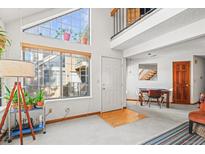 Bright living room with fireplace and vaulted ceilings at 5922 Gunbarrel Ave # E, Boulder, CO 80301