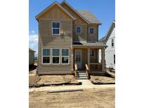 Charming two-story home with covered porch and excellent curb appeal, ready for personalization at 22 Waterford St, Erie, CO 80516