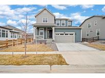 Charming two-story home with a two car garage and inviting front porch at 12777 Clearview St, Firestone, CO 80504