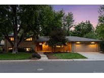 Charming single-Gathering home with brick exterior, mature trees, and a well-manicured front yard at 3190 S Detroit St, Denver, CO 80210