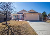 Charming single-Gathering home featuring a two-car garage and well-maintained lawn in a suburban neighborhood at 18274 Peru Creek Ave, Parker, CO 80134