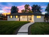 Charming single-story home with a well-maintained lawn and a welcoming walkway leading to the front door at 2999 S Adams St, Denver, CO 80210