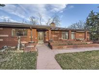 Charming single-story brick home with a well-maintained front yard and covered entry at 8060 Meade St, Westminster, CO 80031