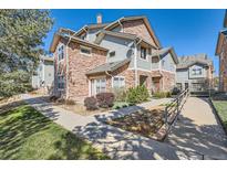 Charming multi-story home features stone accents, manicured landscaping, and inviting walkways at 2541 S Bahama Cir # F, Aurora, CO 80013