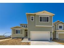 Two-story home featuring a two-car garage and modern architectural details at 4104 Grand Lake St, Brighton, CO 80601