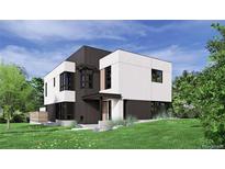 Striking modern home featuring a unique two-tone exterior, large windows, and a well-manicured lawn at 1491 S York St, Denver, CO 80210