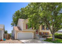Charming two-story home with red shutters, attached garage and mature landscaping at 11200 W 102Nd Ave, Broomfield, CO 80021
