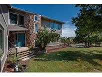 Charming two-story home featuring a stone facade and well-maintained front yard at 8853 N Awl Rd, Parker, CO 80138
