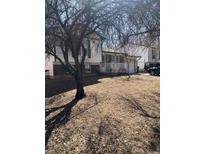 Charming two-story home with a welcoming front porch and well-maintained landscaping, perfect for Gathering living at 2108 S Idalia S St, Aurora, CO 80013