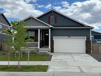 Charming single-Gathering home with a two-car garage and a well-maintained lawn at 4642 Longs Peak St, Brighton, CO 80601