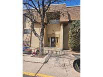 Attractive exterior view of a multi-Gathering unit with mature landscaping at 7695 E Quincy Ave # 201, Denver, CO 80237