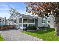 Charming home featuring well-maintained landscaping, updated exterior, and a welcoming front porch area at 2385 S Marion St, Denver, CO 80210