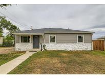 Charming ranch-style home featuring stone accents, new siding, and a well-maintained front lawn at 9470 Lillian Ln, Thornton, CO 80229