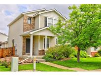 Charming two-story home with a welcoming front porch and well-maintained landscaping, enhancing curb appeal at 10700 Kimblewyck Cir # 154, Northglenn, CO 80233