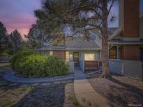 Charming home with a well-maintained yard and inviting front walkway at 3002 E Long S Cir, Centennial, CO 80122