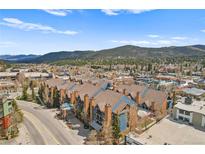 Stunning aerial view of the condos surrounded by a charming mountain town and scenic mountain views at 100 S Park Ave # E312, Breckenridge, CO 80424
