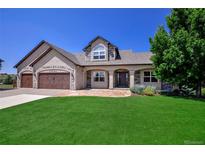 Two-story house with a three-car garage and landscaped lawn at 20190 Sedgemere Rd, Monument, CO 80132