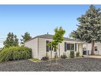 Charming single-story home with a well-maintained front yard and mature trees at 5090 Tejon St, Denver, CO 80221