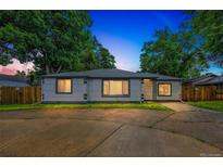 Charming single story home with mature trees and a large driveway at 7010 W 44Th Ave, Wheat Ridge, CO 80033