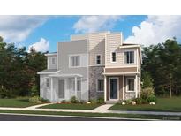 A modern two-story home with a combination of stone and siding, enhanced by well-placed windows and a neatly landscaped front yard at 6642 N Nepal Ct, Aurora, CO 80019