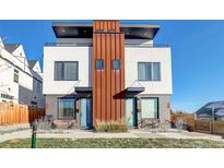 Modern townhome showcasing a striking two-story elevation with unique architectural details and inviting entryways at 1286 Raleigh St, Denver, CO 80204