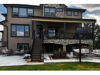 Spacious home featuring a patio and deck for outdoor entertaining and relaxation at 6985 Fallon Cir, Castle Rock, CO 80104