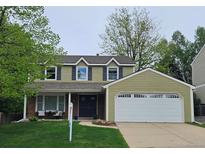 Charming two-story home with a well-manicured lawn and attached two car garage at 6719 E Costilla Cir, Centennial, CO 80112