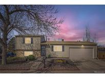 Charming two-story home with a well-manicured front yard and attached two car garage at 4063 S Quintero Way, Aurora, CO 80013