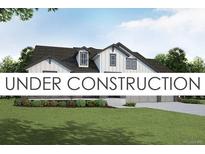 Charming two-story home with black trim, white siding, and a well-manicured front yard at 21821 E Tansy Pl, Aurora, CO 80016