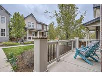 Inviting front porch with comfortable seating and charming architectural details, perfect for relaxing outdoors at 8917 Yates Dr, Westminster, CO 80031