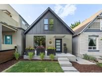 Inviting exterior showcasing manicured lawn and charming facade with modern design elements at 3363 W 32Nd Ave, Denver, CO 80211