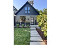 Charming two-story home with modern curb appeal, landscaped yard, and inviting entryway at 3363 W 32Nd Ave, Denver, CO 80211