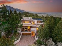 Stunning mountain home with modern design, solar panels, and breathtaking views at 9041 Eastridge Rd, Golden, CO 80403