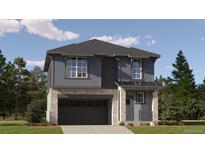 Charming two-story home featuring stone accents, a two-car garage, and a covered front porch at 2176 S Haleyville Way, Aurora, CO 80018