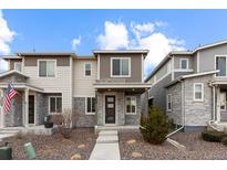 Charming multi-level townhouse with stone accents and neutral color palette at 23630 E 5Th Pl, Aurora, CO 80018