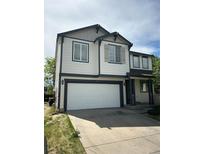 Charming two-story home with a two-car garage and well-maintained lawn at 1145 S Boston St, Denver, CO 80247