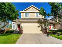 Charming two-story home with attached garage and inviting curb appeal on a sunny day at 5972 S Zante Way, Aurora, CO 80015