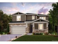 Beautiful two-story home with stone accents, manicured lawn and a two car garage at 14115 Bunny Hop Ln, Parker, CO 80134