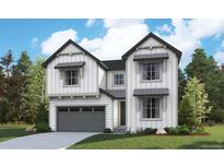 Inviting two-story home featuring vertical siding, modern color palette, and a well-maintained lawn at 8260 Cokedale Cir, Littleton, CO 80125