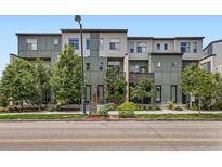 Modern townhome complex with landscaped front yards and contemporary facade at 2507 Moline St, Aurora, CO 80010