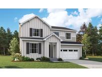 Charming two-story home showcasing a modern farmhouse exterior with vertical siding and a well-manicured lawn at 2656 Sawyer Ln, Erie, CO 80026