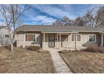 Ranch style home with a covered porch and well-maintained lawn at 4981 E Cornell Ave, Denver, CO 80222