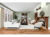 Bright living room with fireplace and modern furnishings, offering a cozy and stylish space at 465 Monroe St, Denver, CO 80206