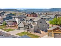 Charming two-story home with a two-car garage in a friendly neighborhood at 4009 Manorbrier Cir, Castle Rock, CO 80104