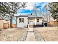 Charming updated bungalow with a modern front porch and landscaped yard at 2649 Utica St, Denver, CO 80212