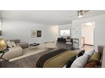Stylishly furnished living space featuring hardwood floors and modern decor at 888 N Logan St # 2E, Denver, CO 80203