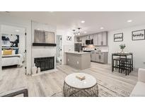 Modern kitchen with gray cabinets, white countertops, and stainless steel appliances at 1825 Kendall St # 101, Lakewood, CO 80214